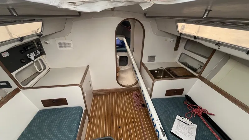 Slide: The Image of Interior of a 2001 J Boats J/105 sailboat, featuring a compact cabin layout. - 17