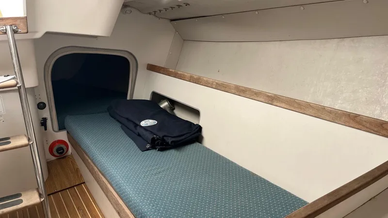 Slide: The Image of Interior cabin of 2001 J Boats J/105 sailboat with cushioned berth. - 18
