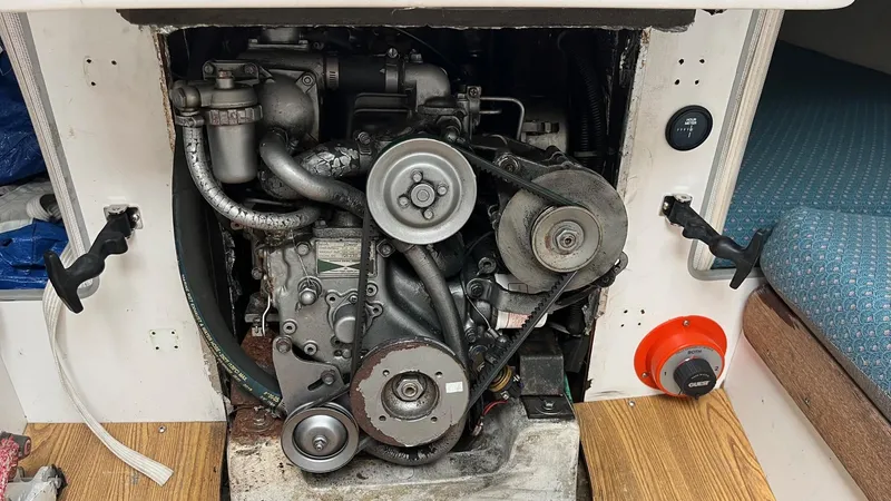 Slide: The Image of Engine compartment of a 2001 J Boats J/105 sailboat, showcasing mechanical components. - 20