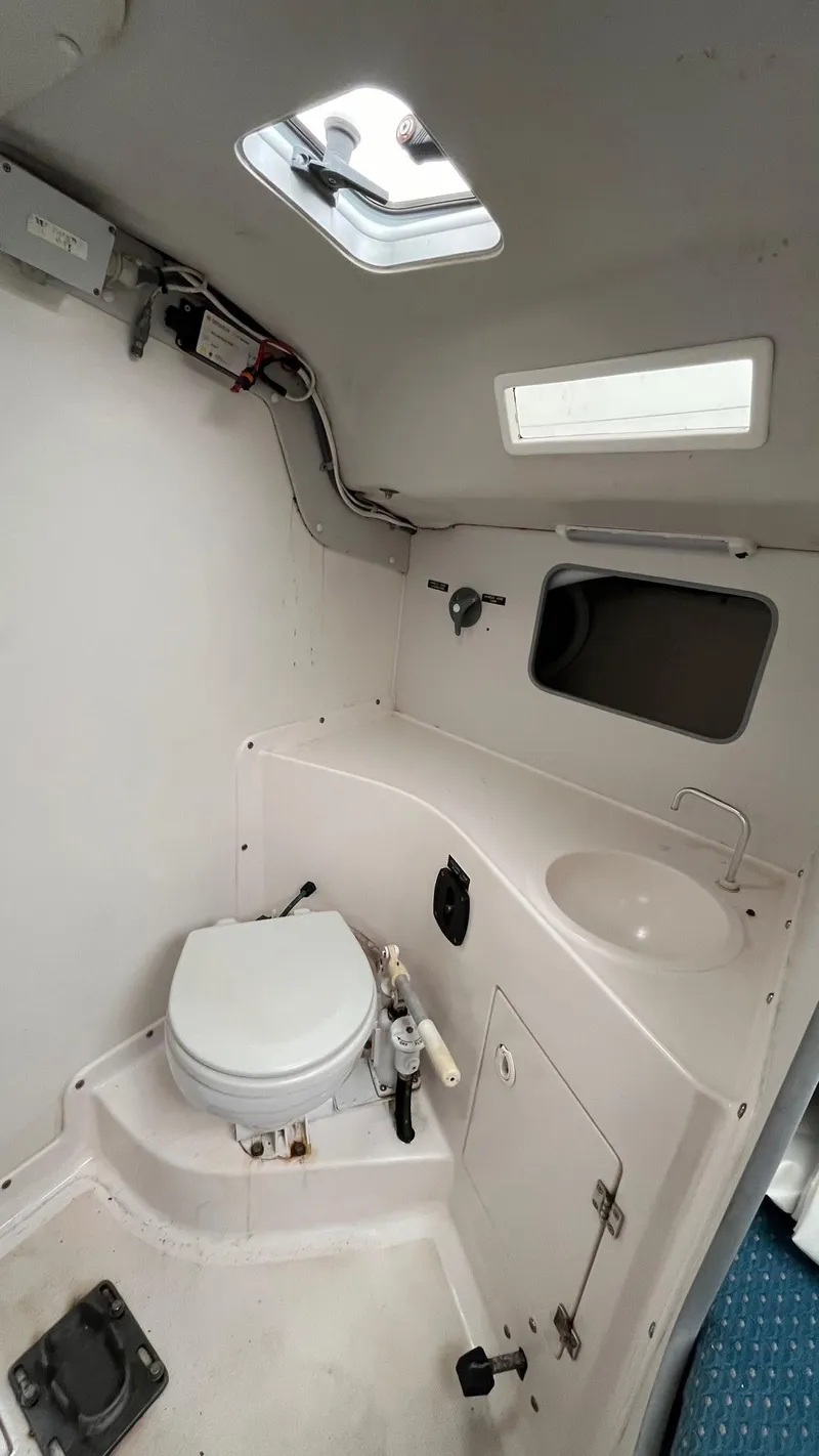 Slide: The Image of 2001 J Boats J/105 interior bathroom with toilet and sink. - 21