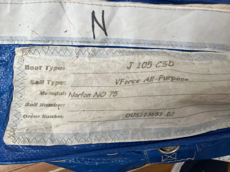 Slide: The Image of Label on a 2001 J Boats J/105 sail, detailing type and order information. - 23