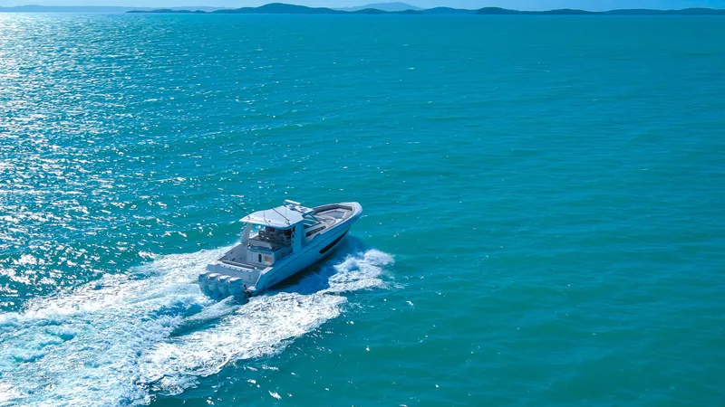 Slide: The Image of 2017 Boston Whaler 420 Outrage cruising on open blue ocean waters. - 7