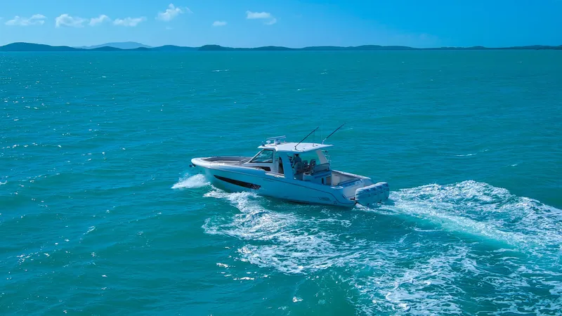 Slide: The Image of 2017 Boston Whaler 420 Outrage cruising on open blue waters. - 8