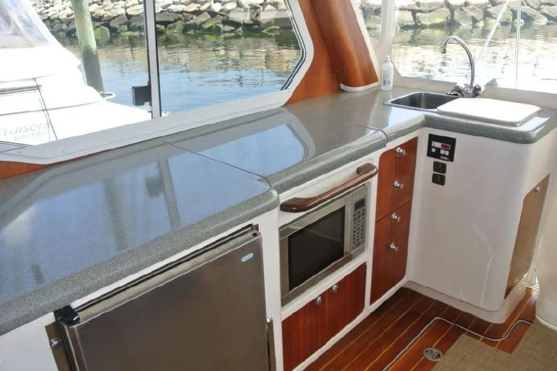 Slide: The Image of 2005 True North 38 Heritage yacht kitchen with modern appliances and sleek countertops. - 19