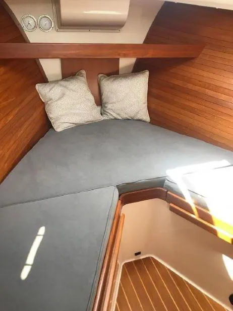 Slide: The Image of 2005 True North 38 Heritage cabin with cozy bedding and wooden interior. - 28