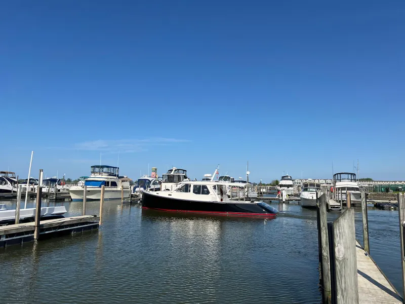 Slide: The Image of Boat docked in marina under clear blue sky, True North 38 Heritage, 2005 model. - 8