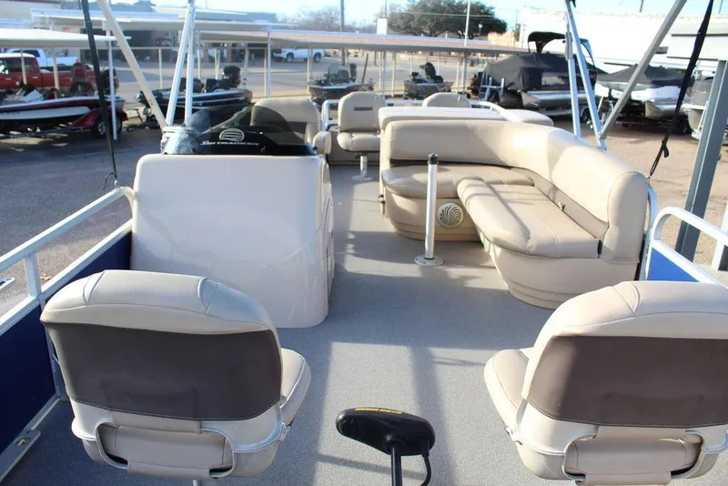 Slide: The Image of 2017 Tracker PARTY BARGE® 22 DLX pontoon boat interior with seating and helm. - 10
