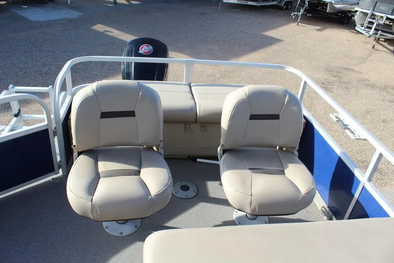 Slide: The Image of 2017 Tracker PARTY BARGE® 22 DLX pontoon boat with beige seating and blue accents. - 14