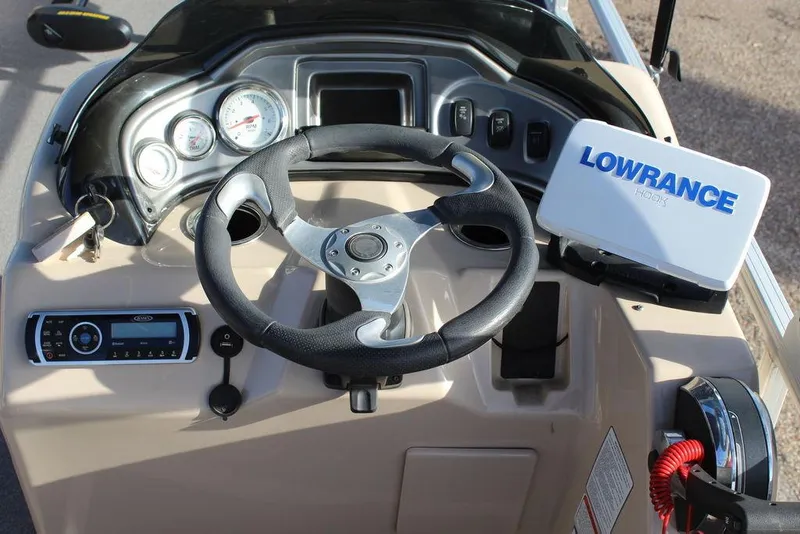 Slide: The Image of Steering console of 2017 Tracker PARTY BARGE® 22 DLX with Lowrance navigation system. - 18