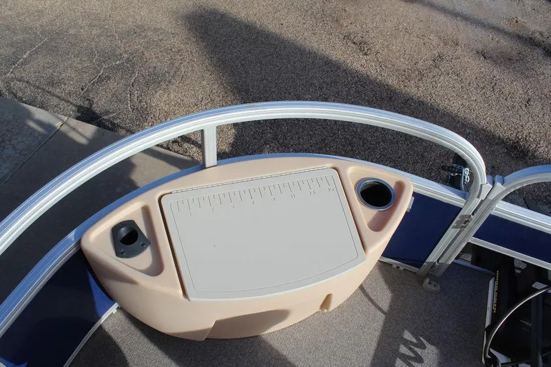 Slide: The Image of 2017 Tracker PARTY BARGE® 22 DLX boat console with cup holders and ruler. - 20