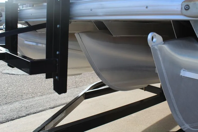 Slide: The Image of 2017 Tracker PARTY BARGE® 22 DLX pontoon boat underside on trailer. - 9