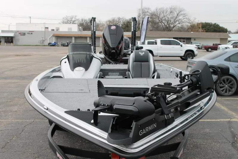 Slide: The Image of 2025 Phoenix 921 Elite II boat with Garmin equipment, parked in a lot. - 3