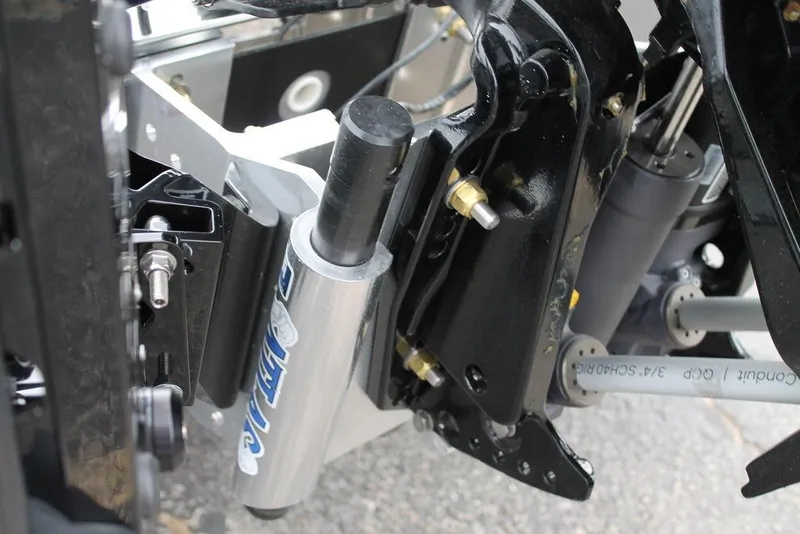 Slide: The Image of Close-up of 2025 Phoenix 921 Elite II suspension system, showcasing shock absorber and mechanical components. - 7