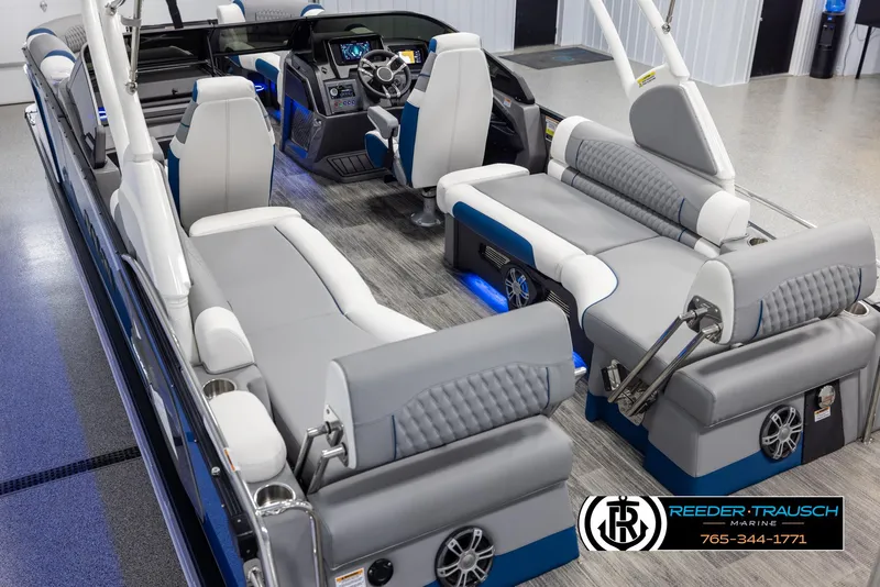 Slide: The Image of Luxurious 2025 Avalon Excalibur LTD QLW boat interior with modern seating and advanced dashboard. - 11