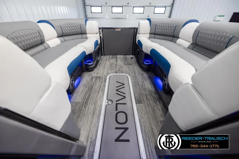 Slide: The Image of Luxurious 2025 Avalon Excalibur LTD QLW interior with plush seating and ambient lighting. - 18