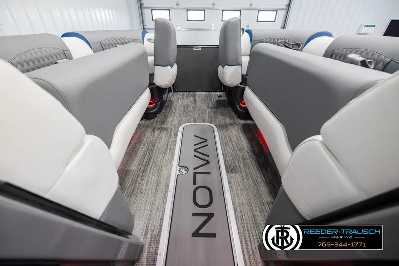 Slide: The Image of 2025 Avalon Excalibur LTD QLW interior with gray seating and branded flooring. - 19