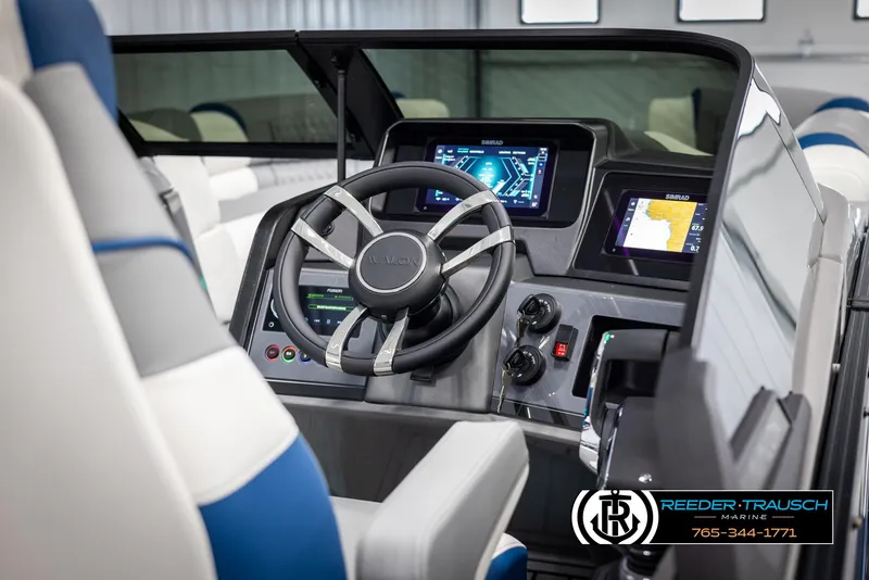 Slide: The Image of 2025 Avalon Excalibur LTD QLW boat dashboard with modern controls and digital displays. - 26
