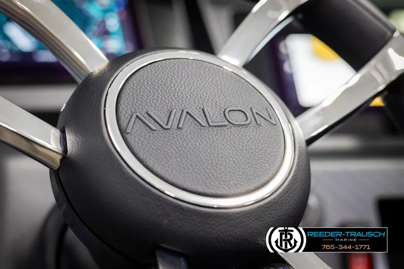Slide: The Image of Steering wheel of 2025 Avalon Excalibur LTD QLW with logo detail. - 28