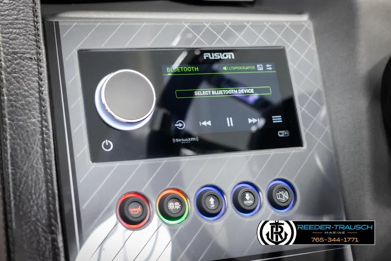 Slide: The Image of 2025 Avalon Excalibur LTD QLW dashboard with Bluetooth audio controls and colorful buttons. - 29