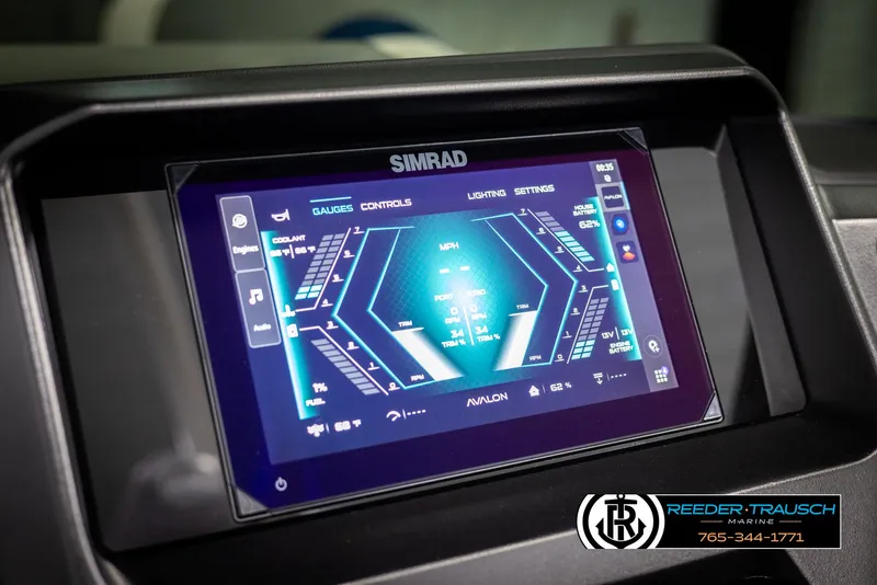 Slide: The Image of 2025 Avalon Excalibur LTD QLW dashboard with Simrad touchscreen display, featuring navigation and controls. - 30