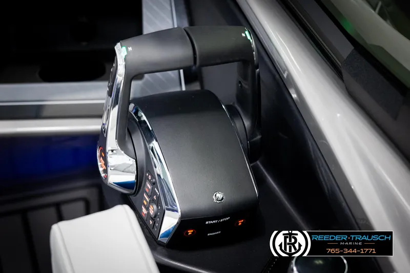 Slide: The Image of Throttle control system in a 2025 Avalon Excalibur LTD QLW boat cockpit. - 35