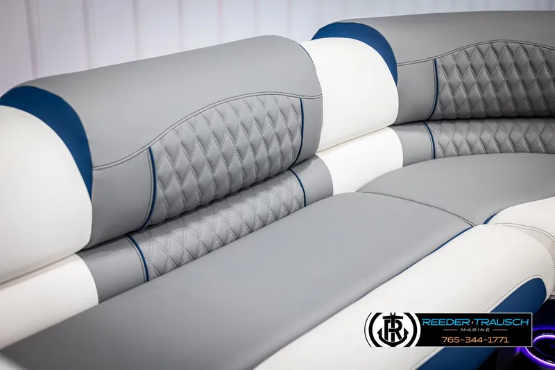 Slide: The Image of Luxurious Avalon Excalibur LTD QLW 2025 boat seating with elegant gray and white upholstery. - 38