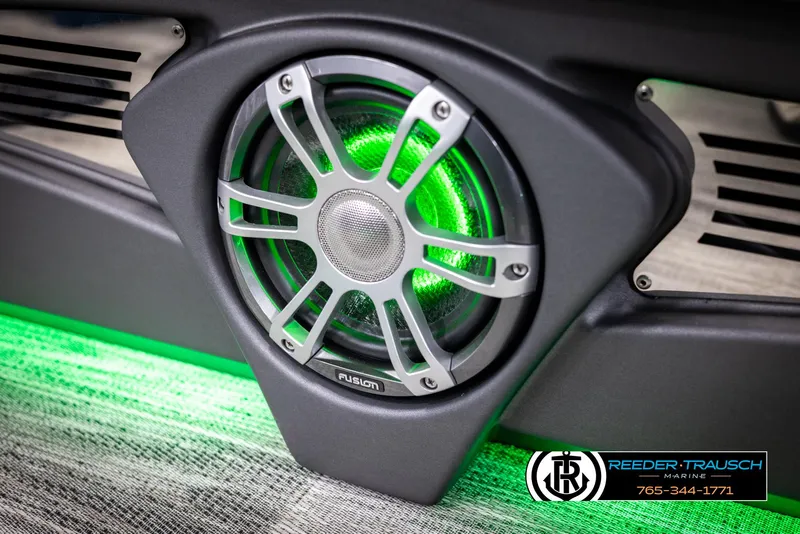 Slide: The Image of 2025 Avalon Excalibur LTD QLW speaker with green LED lighting, Reeder-Trausch Marine branding. - 47