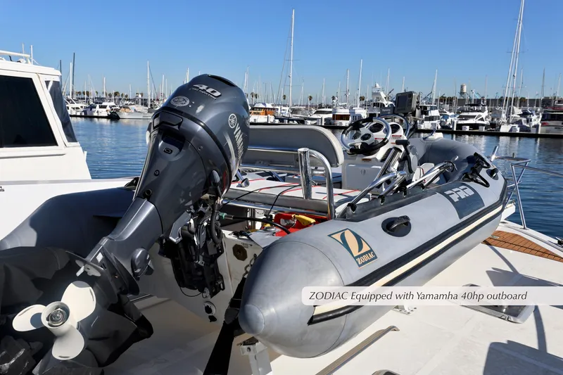 Slide: The Image of Inflatable Zodiac boat with Yamaha 40hp outboard motor docked at marina. - 14