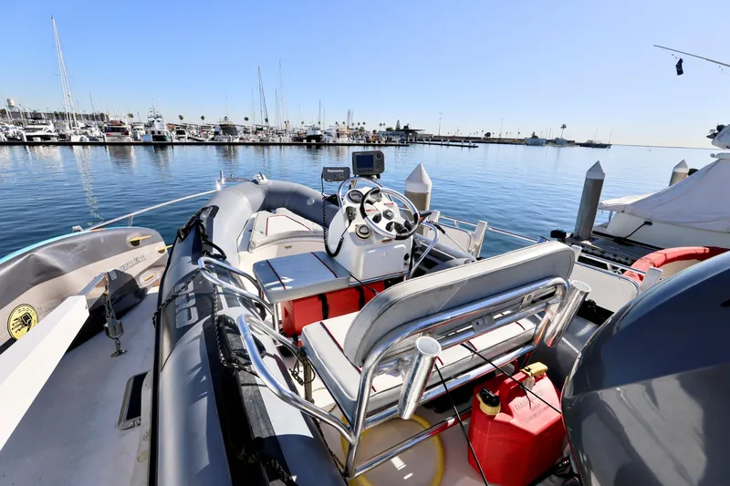 Slide: The Image of 1996 Mediterranean convertible boat docked at marina, sunny day, clear blue water. - 15