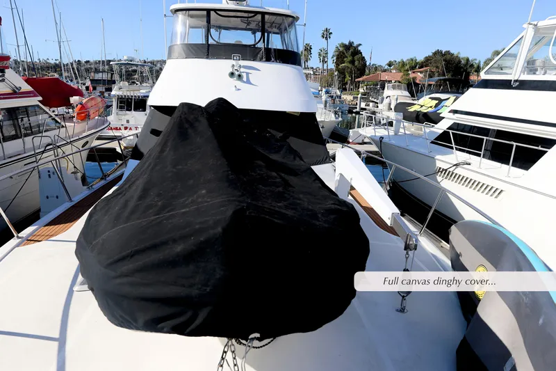 Slide: The Image of 1996 Mediterranean convertible yacht with full canvas dinghy cover in marina. - 16