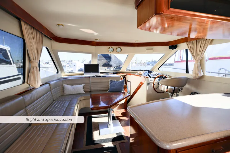 Slide: The Image of Bright and spacious salon in a 1996 Mediterranean convertible yacht interior. - 20