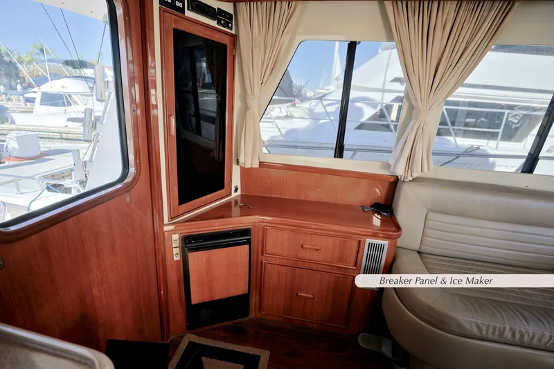 Slide: The Image of Interior of a 1996 Mediterranean convertible boat with breaker panel and ice maker. - 25