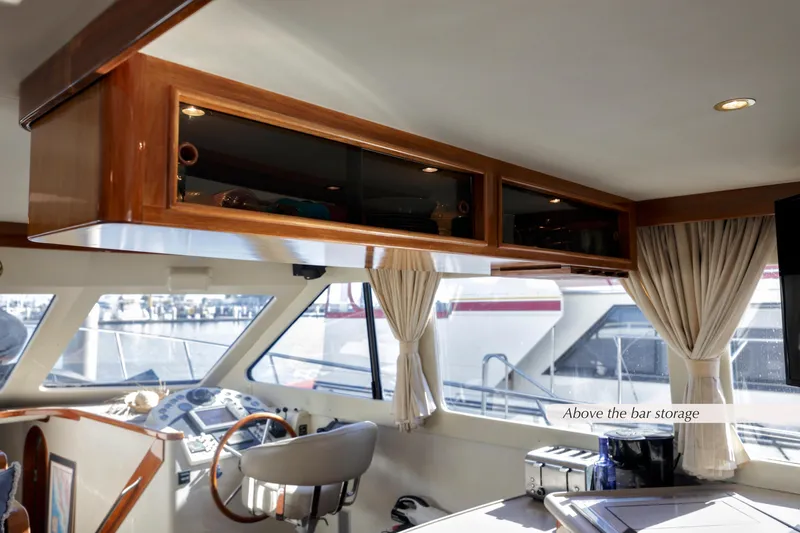 Slide: The Image of Interior of 1996 Mediterranean convertible yacht with bar storage and helm station. - 27