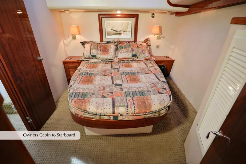 Slide: The Image of 1996 Mediterranean convertible yacht owner's cabin with double bed and nautical decor. - 28