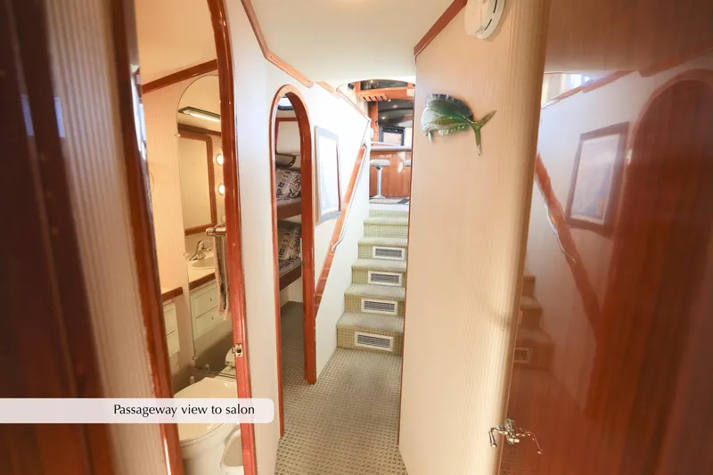 Slide: The Image of Passageway in 1996 Mediterranean convertible yacht leading to salon, featuring elegant wood finishes. - 33