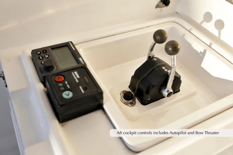 Slide: The Image of 1996 Mediterranean convertible boat cockpit controls with autopilot and bow thruster. - 8