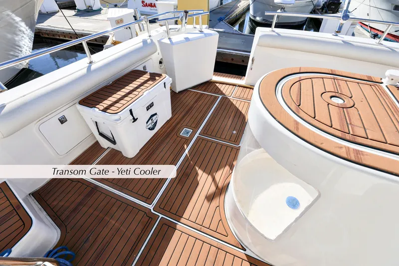 Slide: The Image of 1996 Mediterranean convertible yacht deck with Yeti cooler and teak flooring. - 9