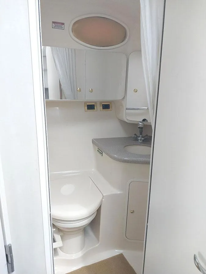 Slide: The Image of 1997 Sea Ray 370 Aft Cabin bathroom with compact design and modern fixtures. - 19