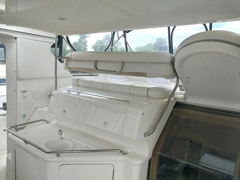 Slide: The Image of 1997 Sea Ray 370 Aft Cabin interior with sink and seating area. - 3