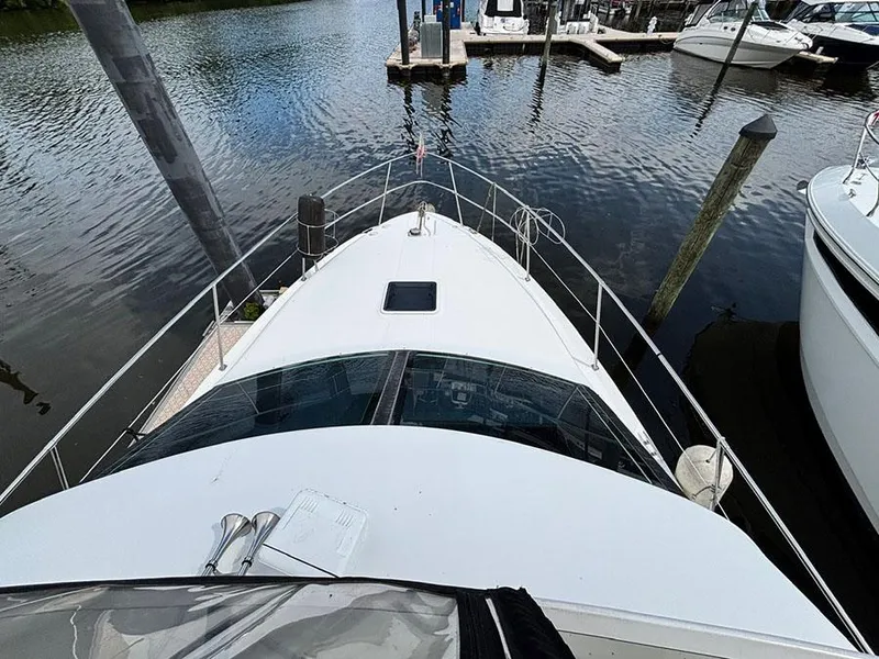 Slide: The Image of 1997 Sea Ray 370 Aft Cabin yacht docked at marina, top view. - 31