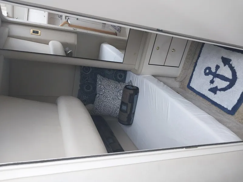 Slide: The Image of Interior cabin of 1997 Sea Ray 370 Aft Cabin with bed and nautical decor. - 4