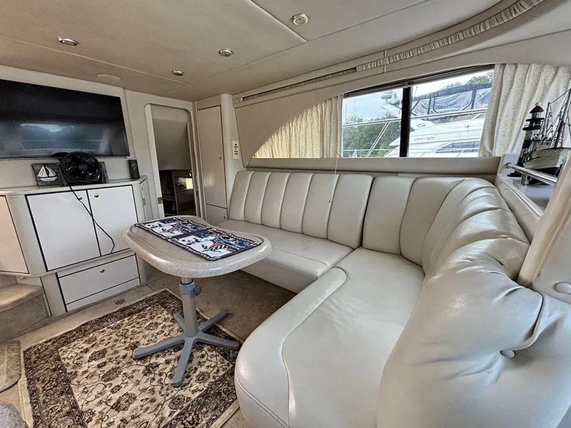 Slide: The Image of Luxurious interior of 1997 Sea Ray 370 Aft Cabin with plush seating and modern amenities. - 40