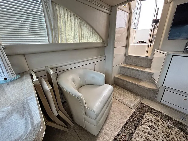 Slide: The Image of 1997 Sea Ray 370 Aft Cabin interior with plush seating and elegant decor. - 41