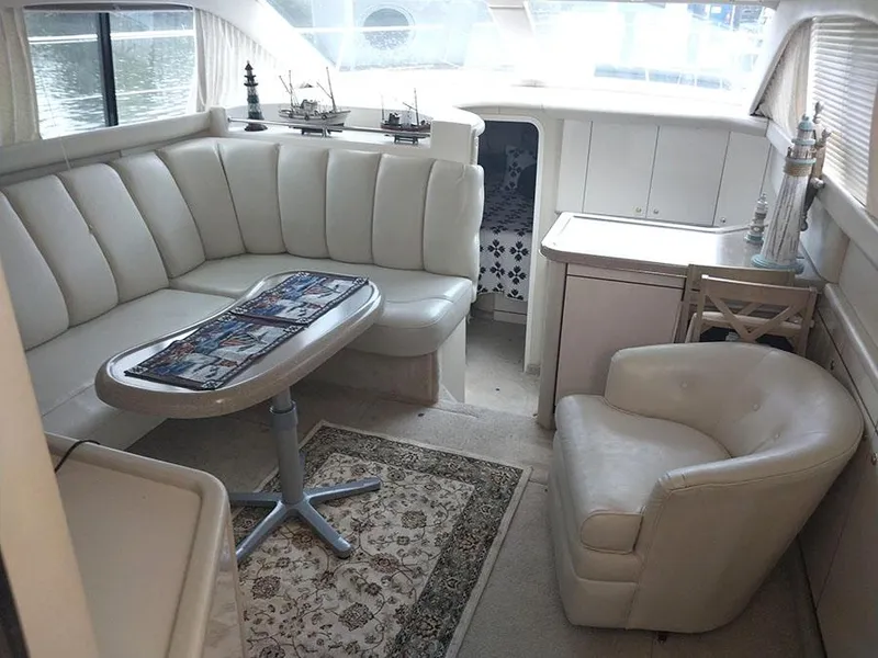 Slide: The Image of Luxurious 1997 Sea Ray 370 Aft Cabin interior with plush seating and elegant decor. - 9