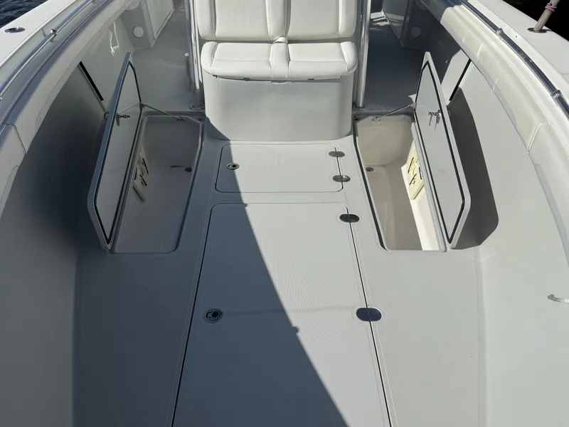 Slide: The Image of 2018 Bluewater Center Console boat interior with open storage compartments. - 11