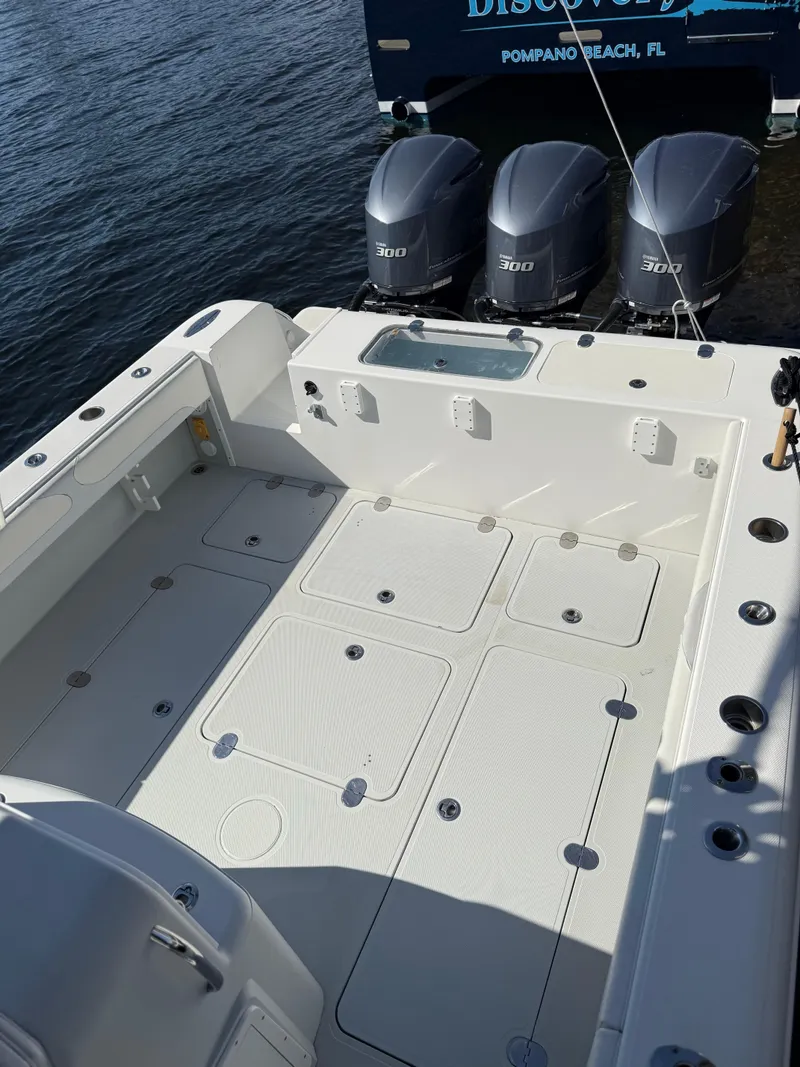 Slide: The Image of 2018 Bluewater Center Console boat with triple engines, docked at Pompano Beach, FL. - 5