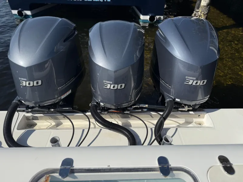 Slide: The Image of Triple Yamaha 300 engines on a 2018 Bluewater Center Console boat. - 7