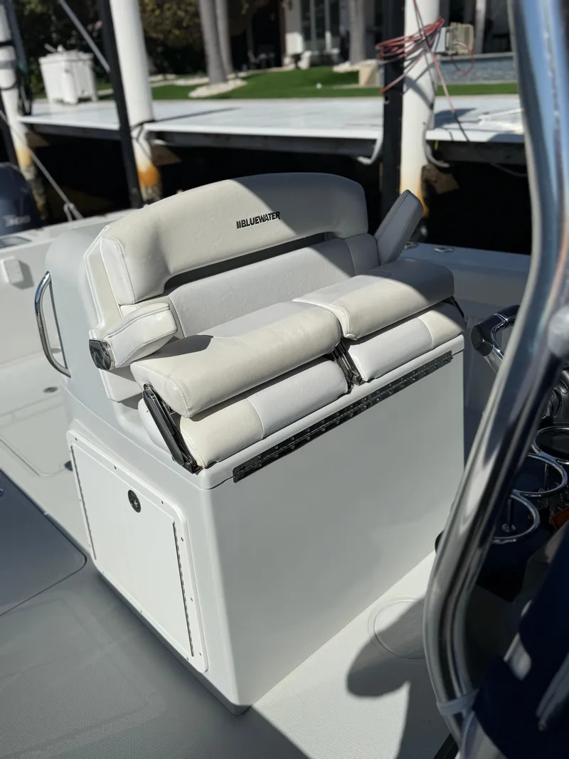 Slide: The Image of 2018 Bluewater Center Console boat with cushioned seating and storage. - 8