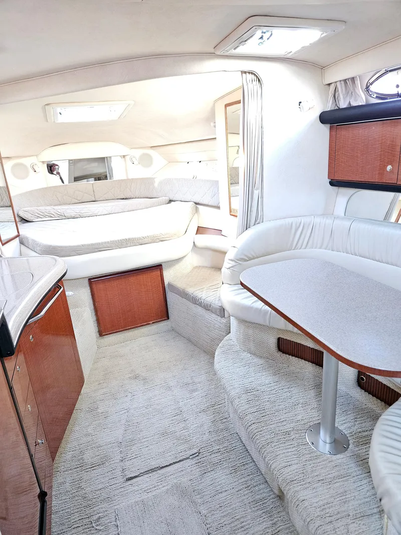 Slide: The Image of 2003 Sea Ray 340 Sundancer interior with plush seating and elegant design. - 7