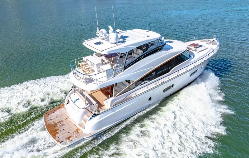 Slide: The Image of 2025 Belize 66 Daybridge yacht cruising on open water, showcasing sleek design and luxury features. - 26
